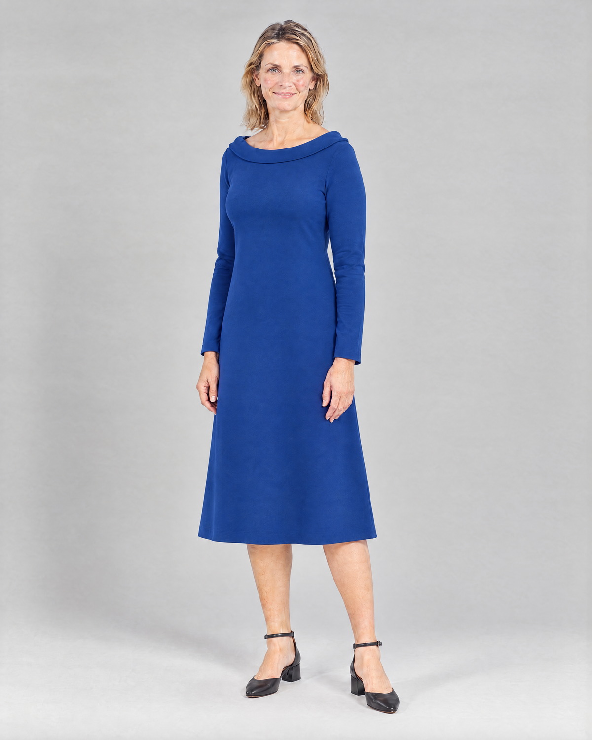 STORY TALL Punto – cobalt blue A-line dress, three-quarter view, portrait neckline