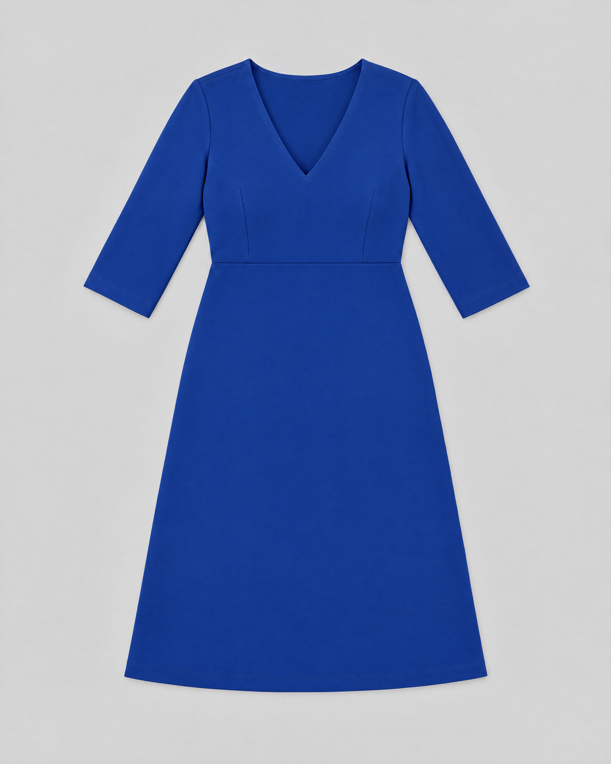 STORY CURVE Punto – cobalt blue A-line dress laid flat, front view