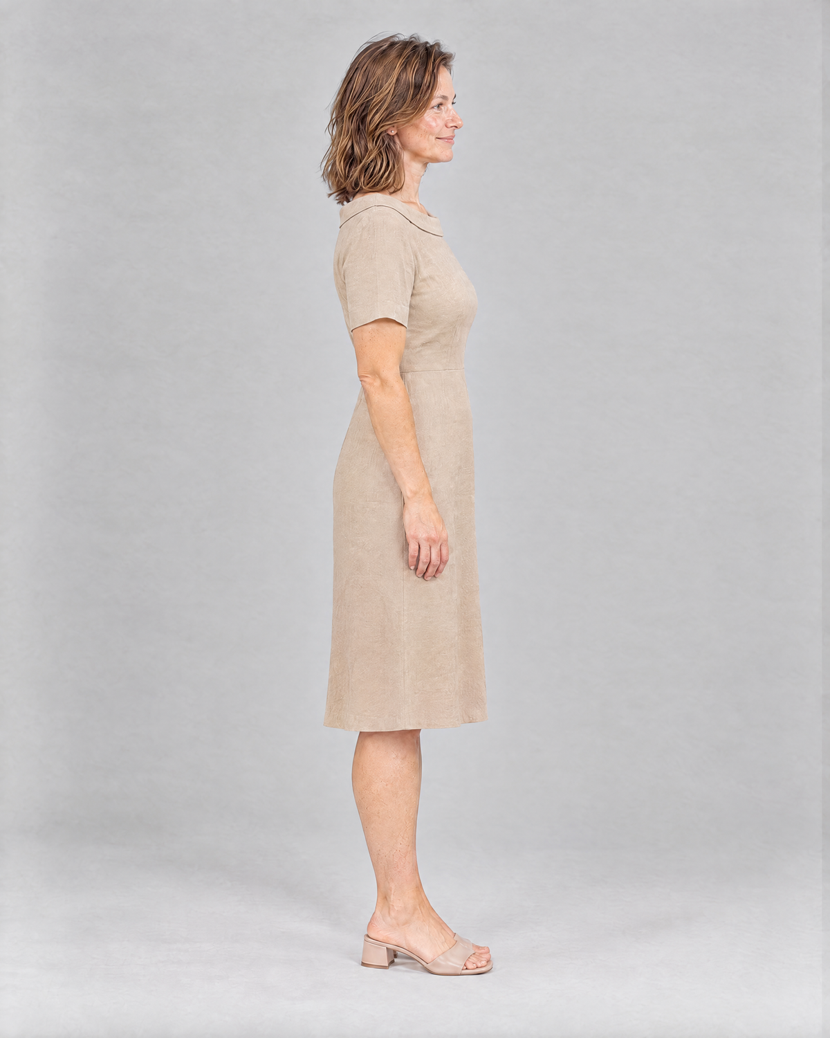 STORY PETITE Beige linen dress side view showing the gentle A-line skirt