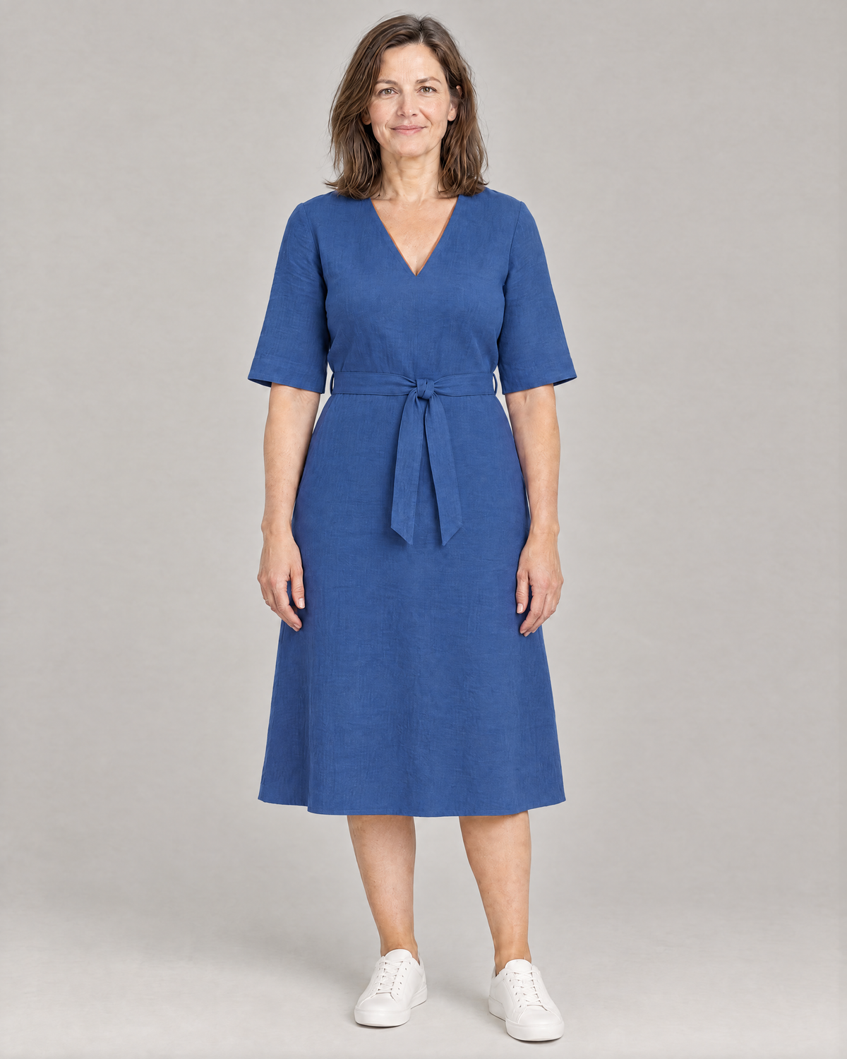 PASSPORT blue Dutch linen A-line midi dress with elbow sleeves and tie belt, front view