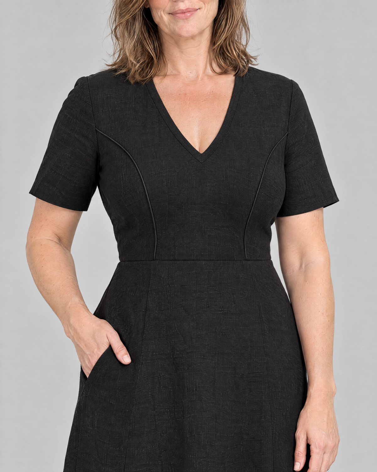 ROOM dress detail: matte piping along the curved princess seams, linen texture and side-seam pocket