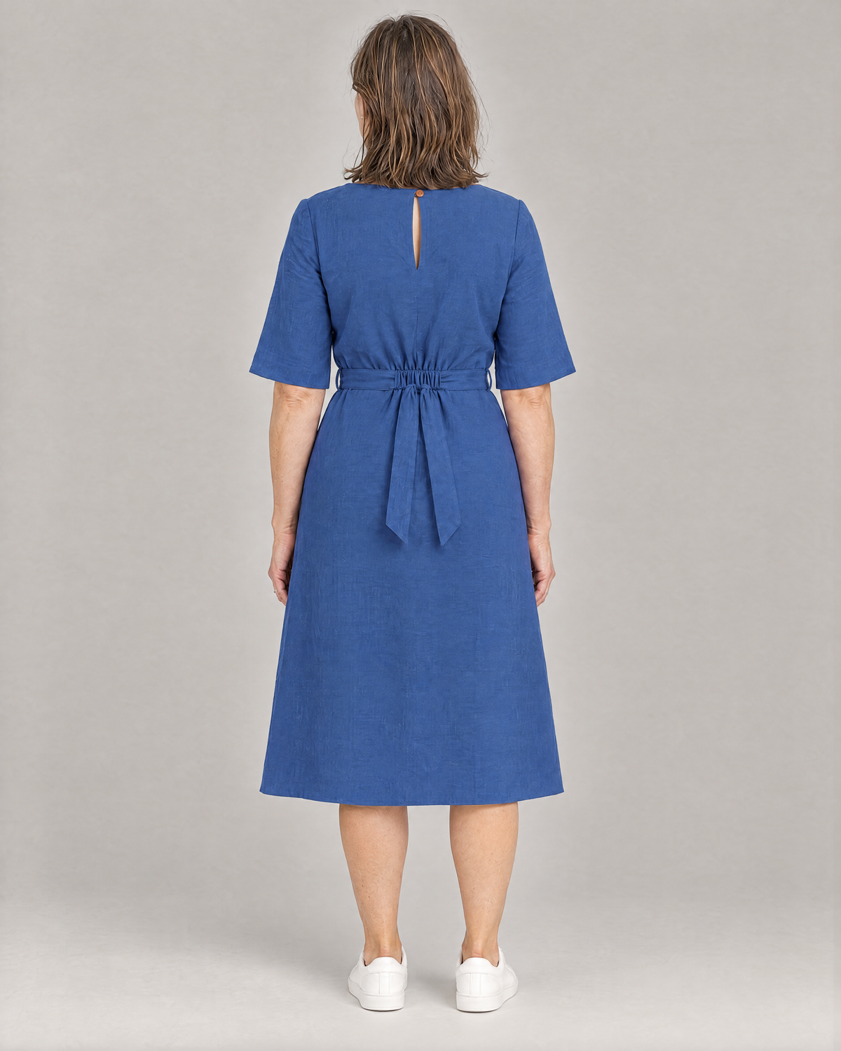 PASSPORT blue linen midi dress, back view with elasticated waist and button keyhole