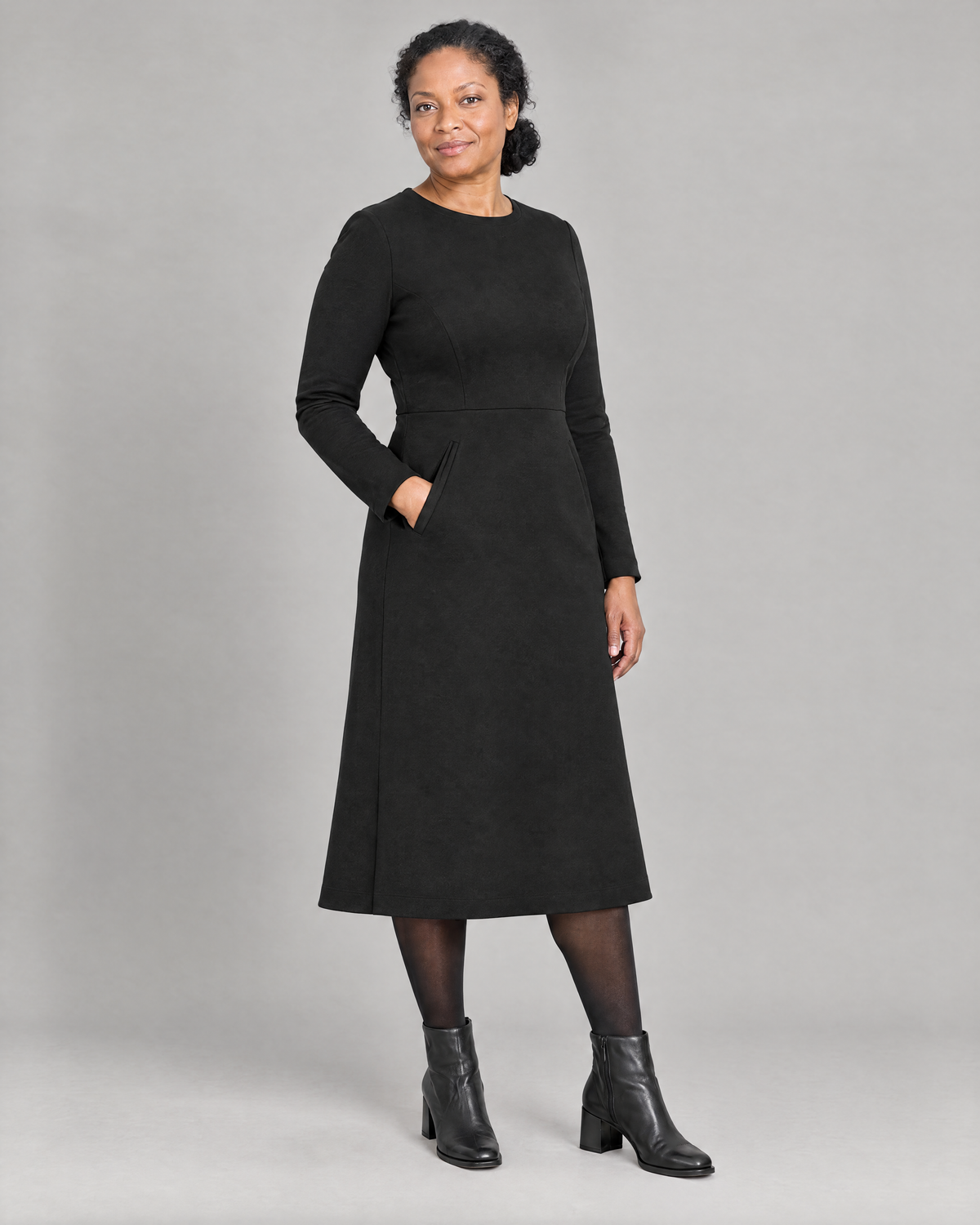 GLIDE black wool A-line midi dress, three-quarter view