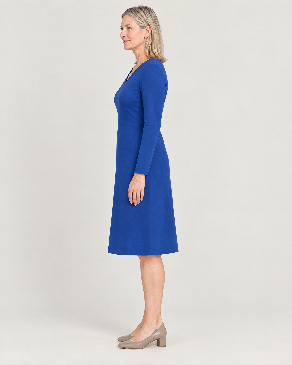 DESK cobalt dress, side view showing the gentle A-line skirt and below-the-knee length