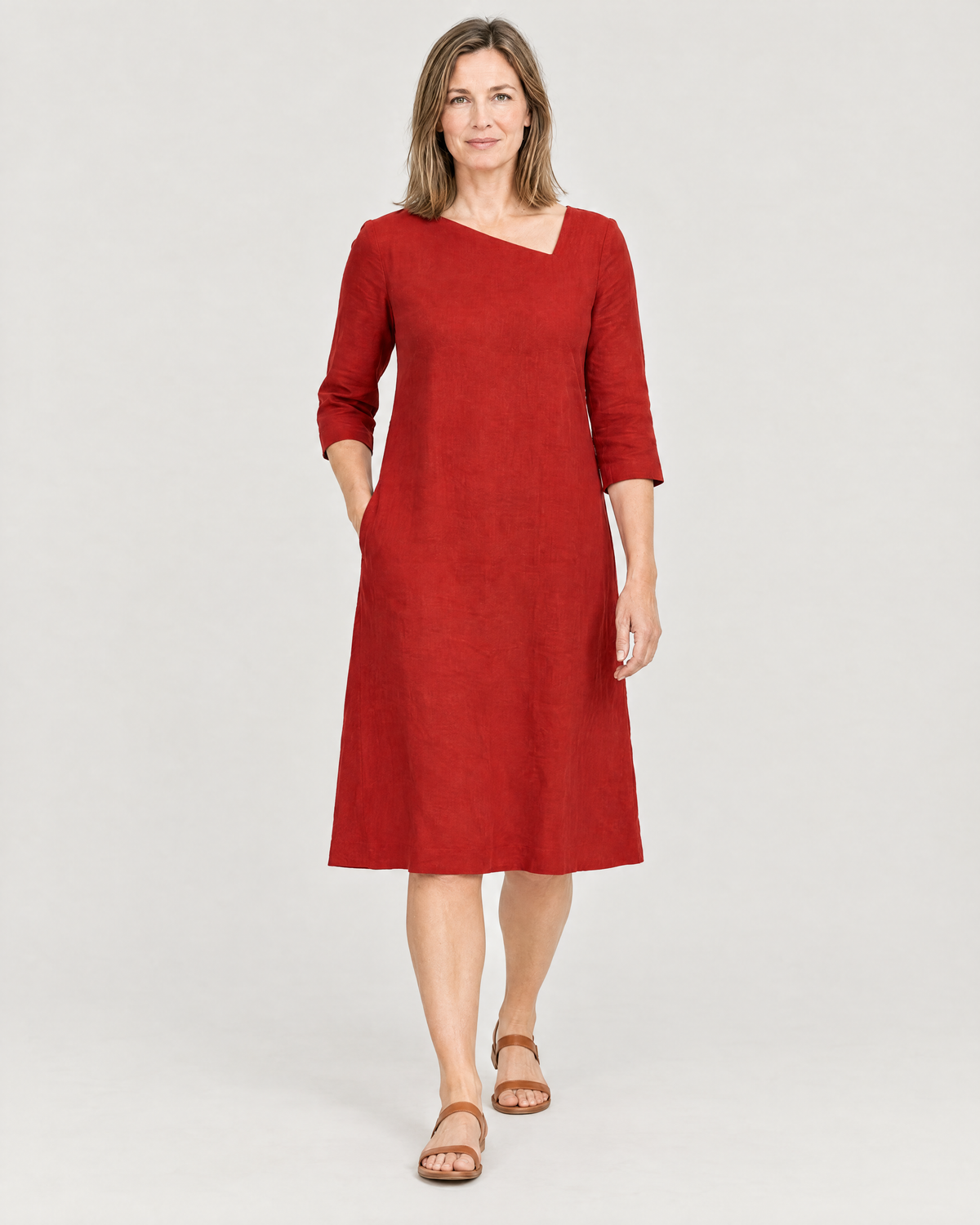 Woman walking in the HUE red linen A-line dress