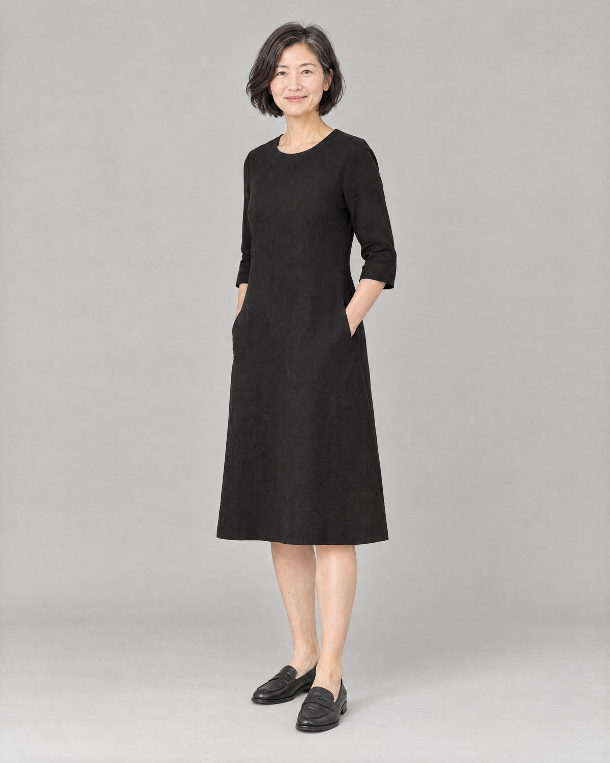 BASE black linen dress, three-quarter view