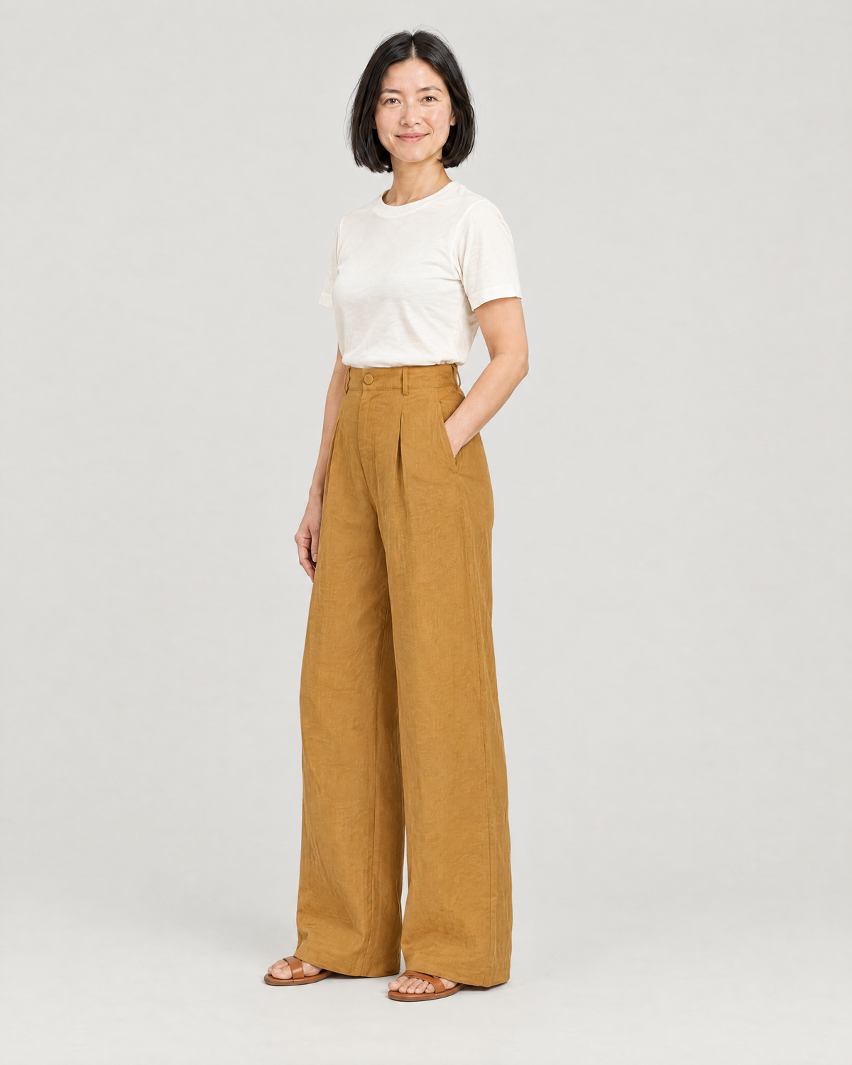 LYRA OPAQUE ochre linen wide-leg trousers, three-quarter view