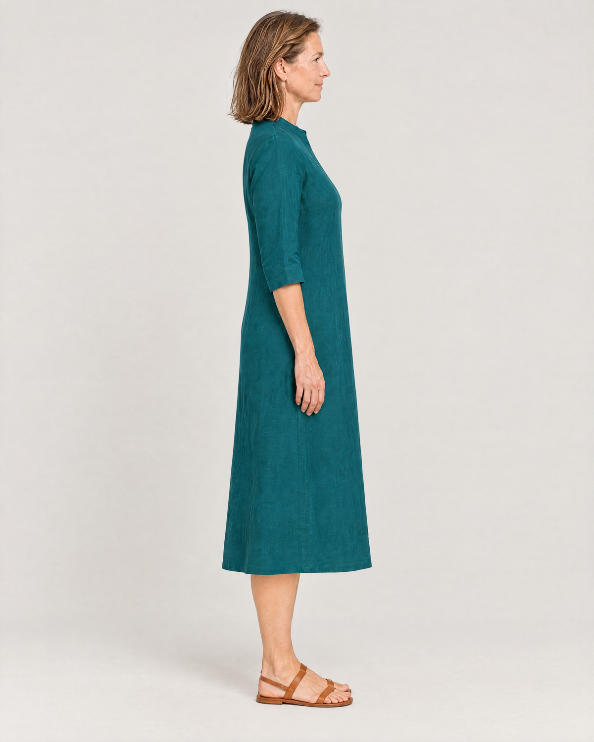 SUMMER COLOUR teal linen dress, side view showing the gentle A-line and mid-calf length