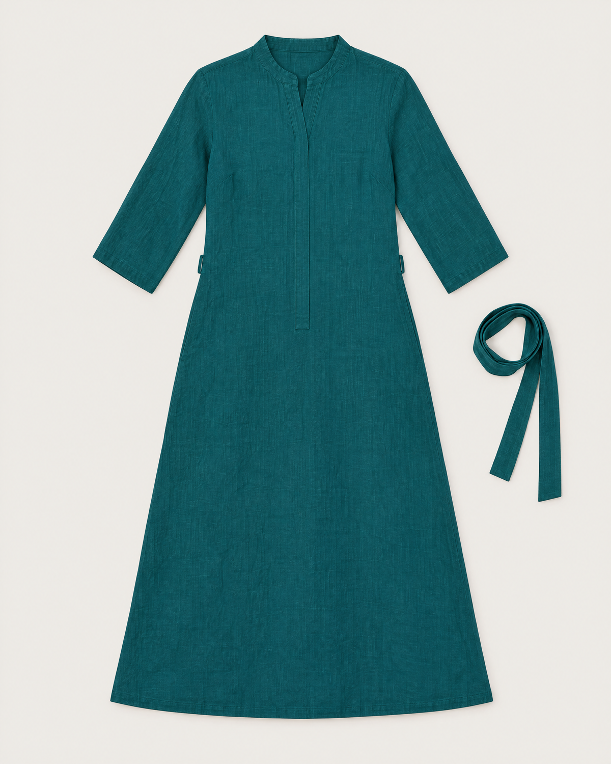 SUMMER COLOUR teal linen dress laid flat with the optional tie belt