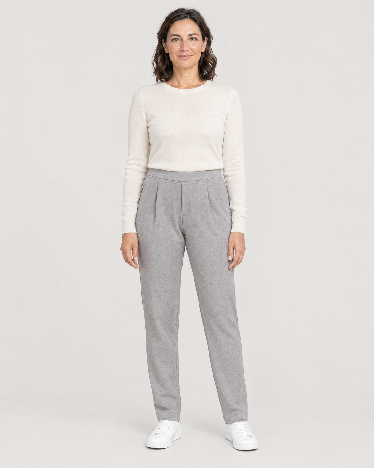 TRAVEL WARM light grey wool tapered trousers with two front pleats and a flat waistband, front view