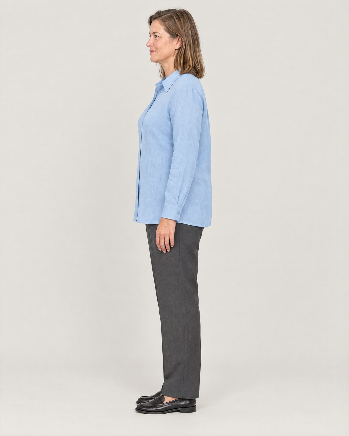 SOFT SHIRT light blue linen shirt, side view showing the straight hem at hip length