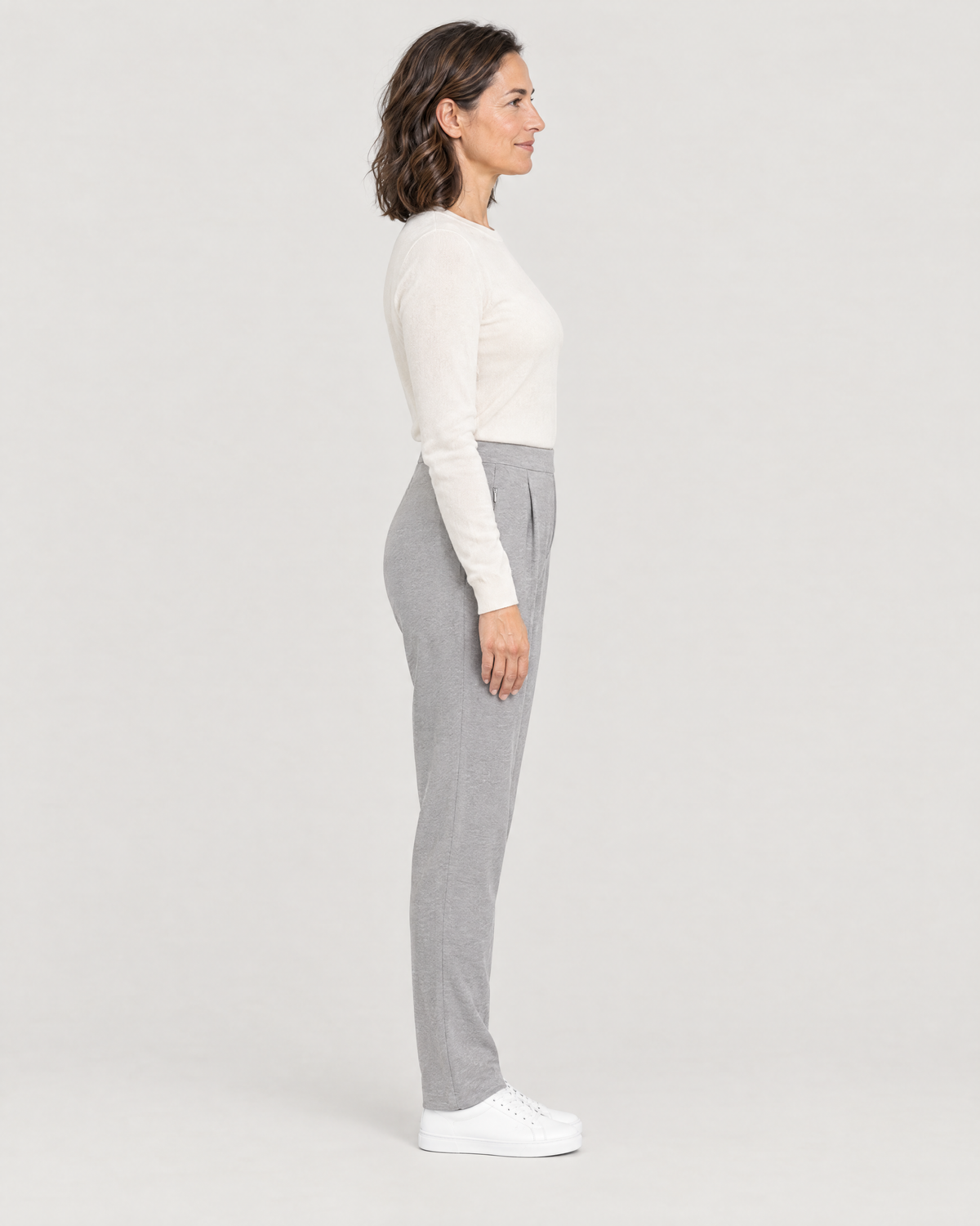 TRAVEL WARM light grey trousers, side view showing the leg tapering from the knee