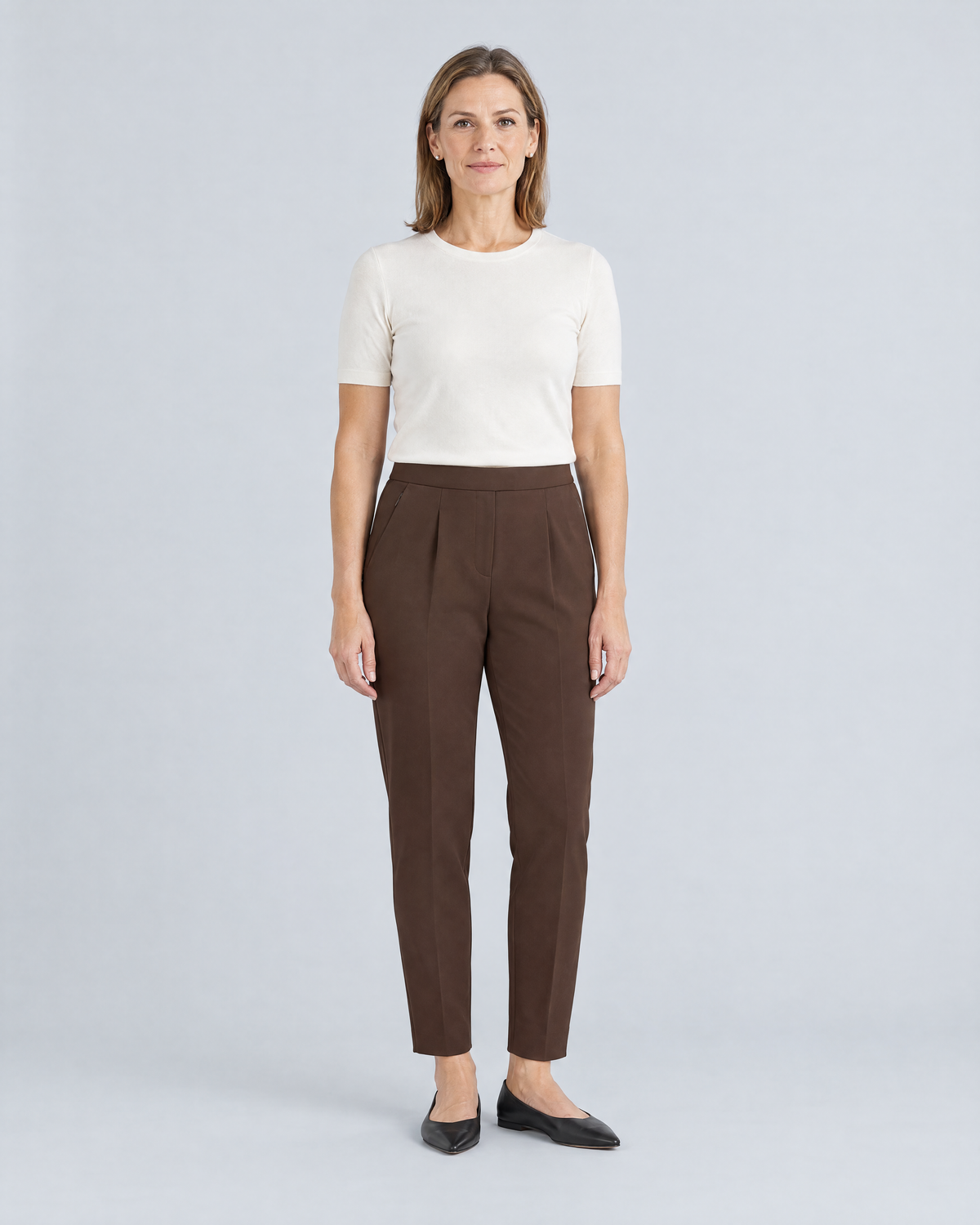 SIT WELL brown tapered office trousers with flat waistband and front pleats, front view