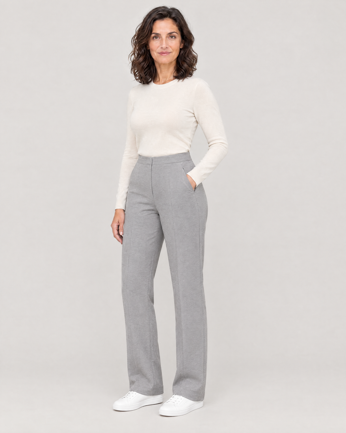 GRAPHITE CURVE FIT light grey trousers, three-quarter view with a hand in the slanted front pocket