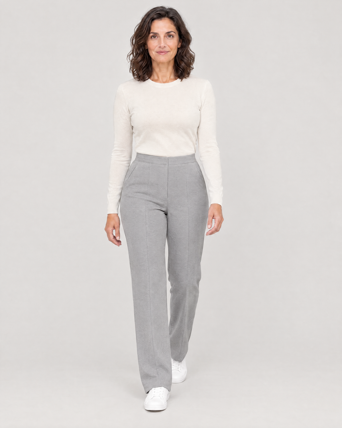 Woman walking in GRAPHITE CURVE FIT light grey straight-leg trousers