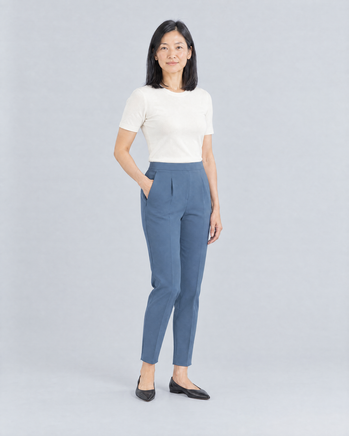 SIT WELL blue trousers, three-quarter view