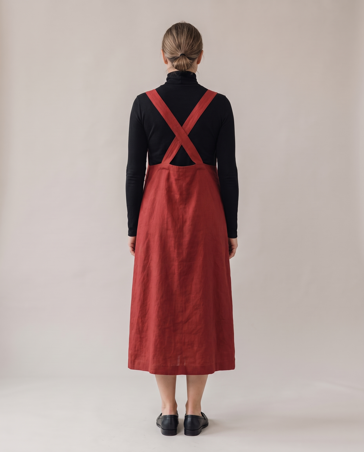 LAYER linen pinafore dress in Red, back view with crossed straps