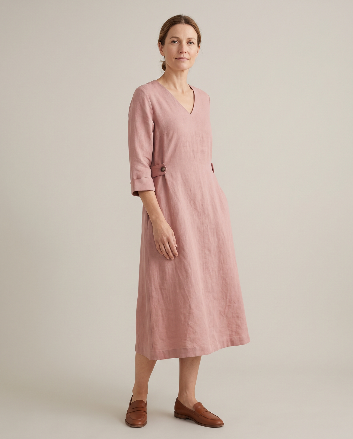 IDA dusty rose linen dress, three-quarter view with the side tab buttoned