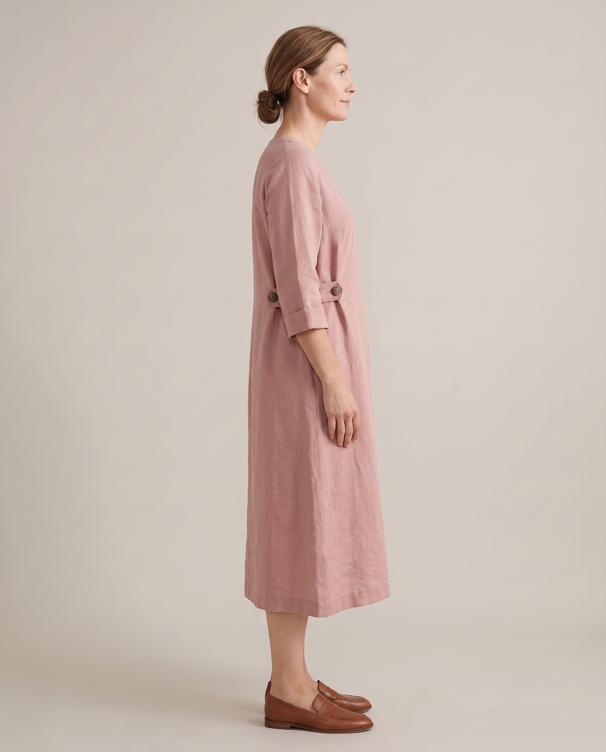 IDA dusty rose dress from the side with the tabs unbuttoned, relaxed fit