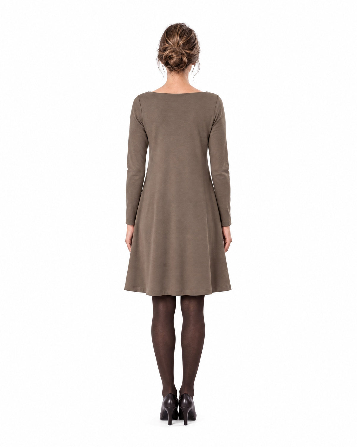 A woman modeling a brown long-sleeve A-line dress with a boat neckline, seen from behind showing the back and A-line skirt. #Color_Brown