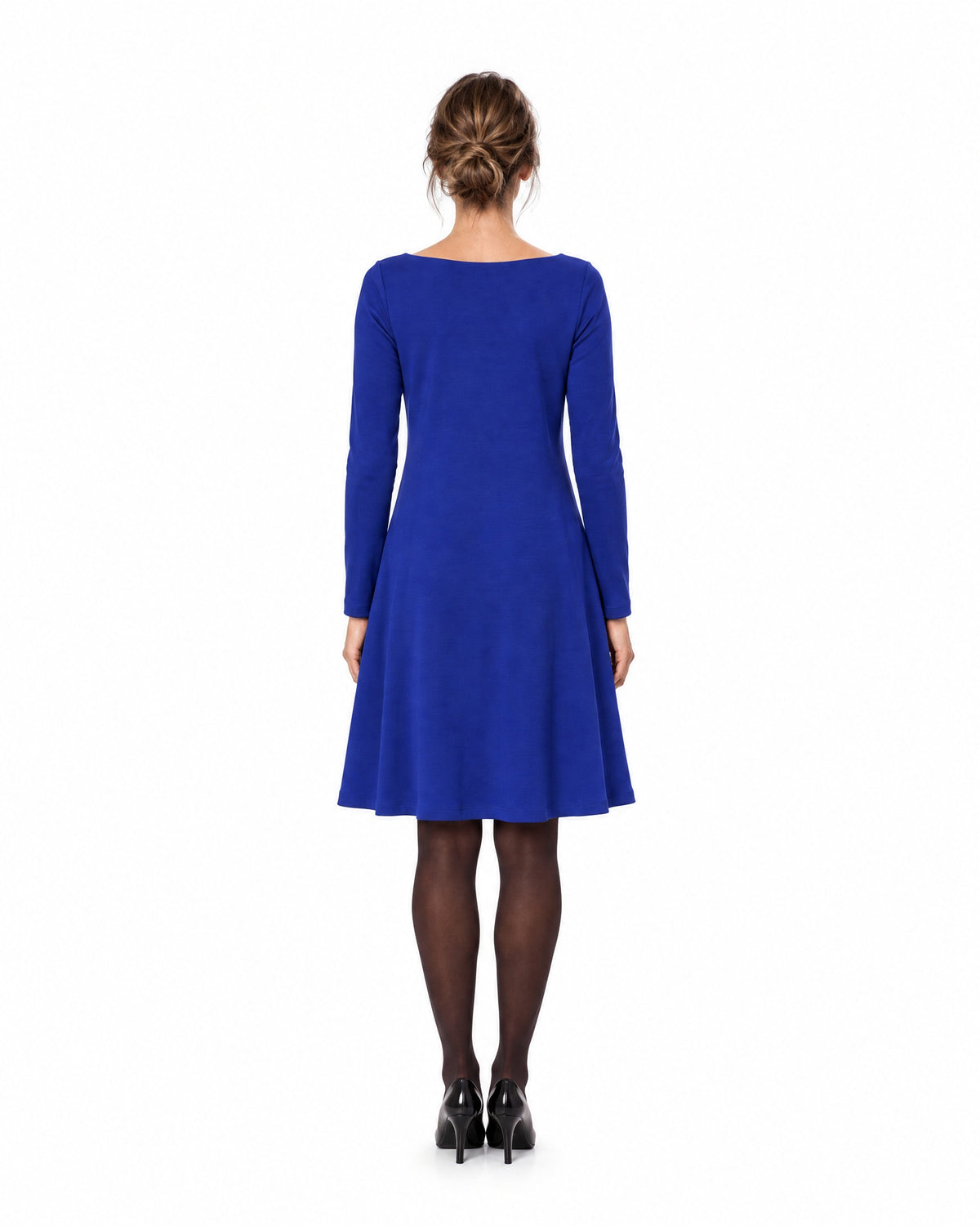 A woman modeling a sapphire blue long-sleeve A-line dress with a boat neckline, seen from behind showing the back and A-line skirt. #Color_Sapphire blue