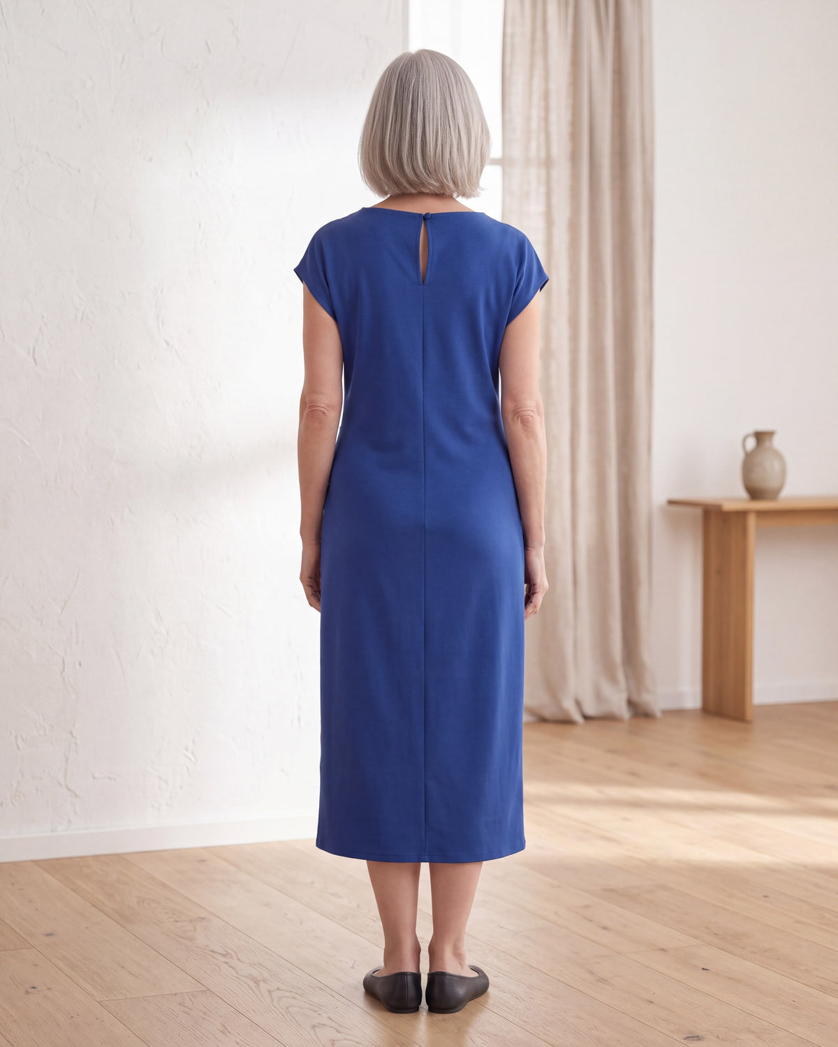 LIVIA cobalt dress, back view with button opening at the neck