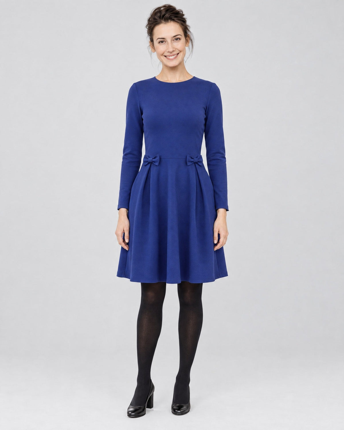 MADMUAZEL Punto Milano dress in sapphire blue, front view, full length, long sleeves, round neckline, waist bows and side pockets