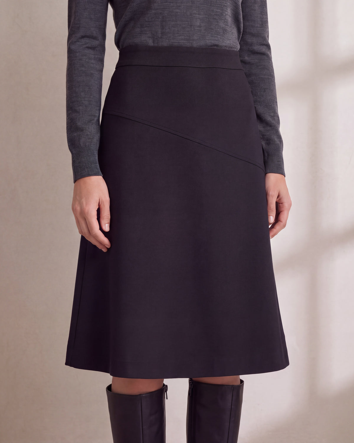 MIDNIGHT Black A-line midi skirt, close front view