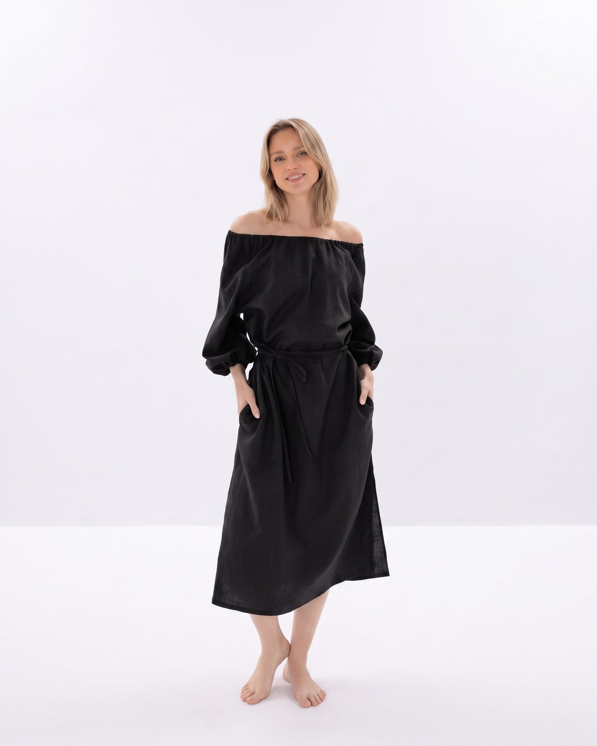 MOON – Black off-shoulder linen midi dress, front view full length in studio #Color_Black