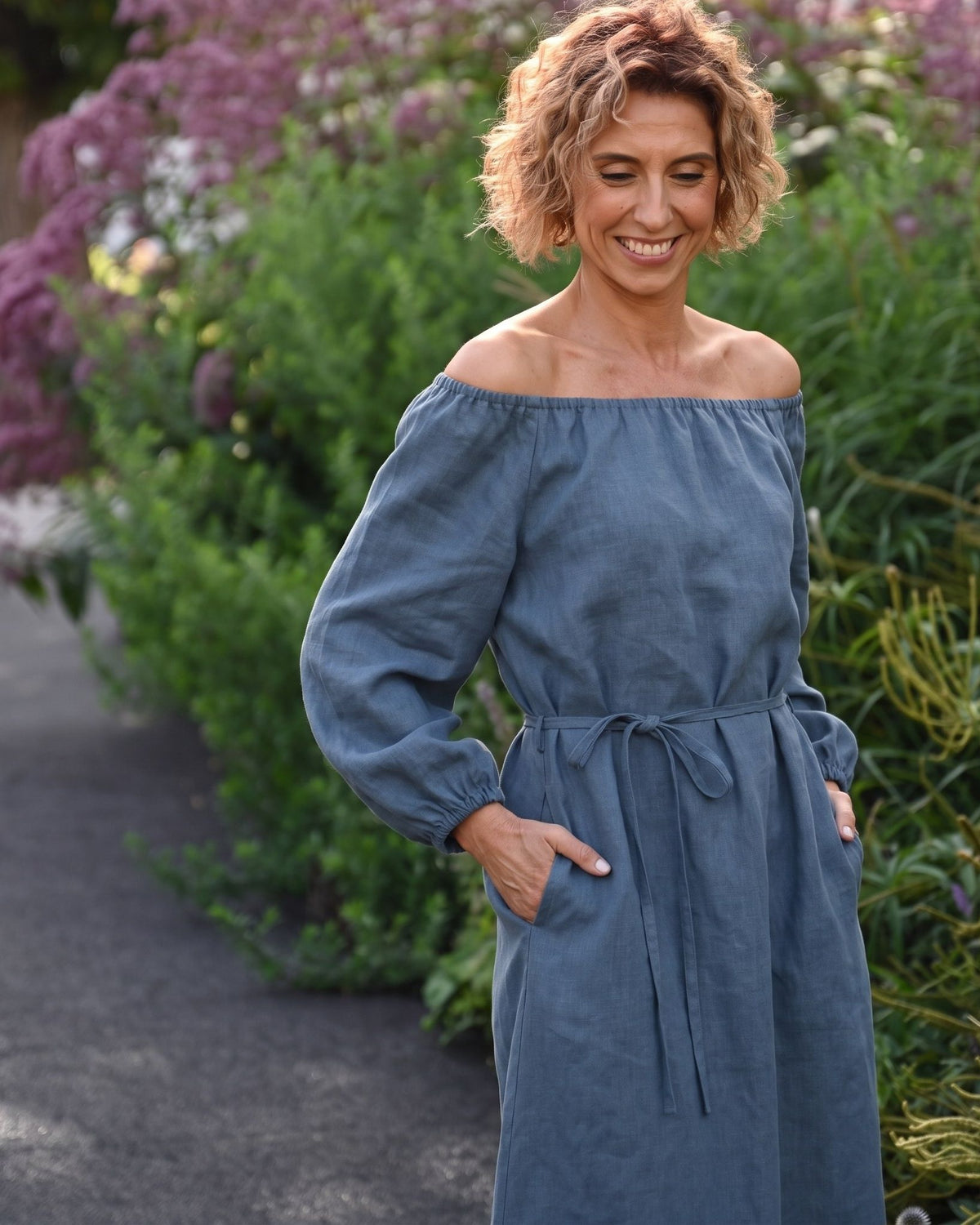 MOON – Blue off-shoulder linen midi dress, lifestyle in a garden #Color_Blue