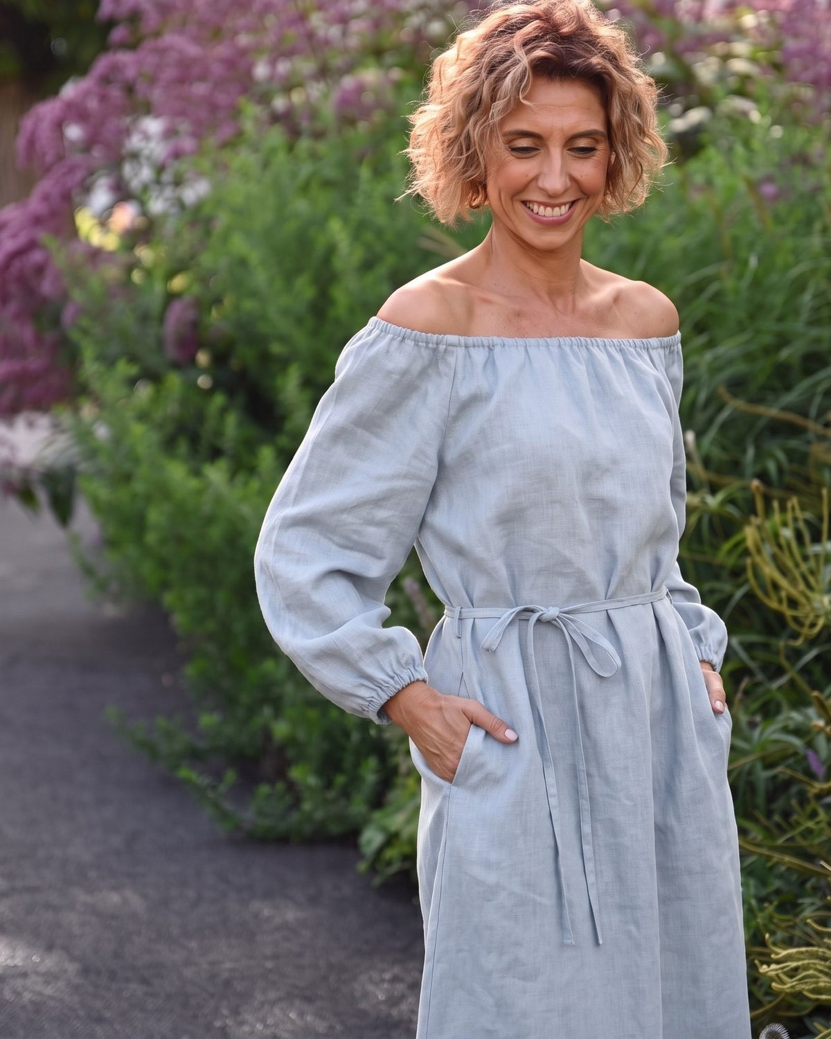 MOON – Light blue off-shoulder linen midi dress, lifestyle in a garden #Color_Light blue