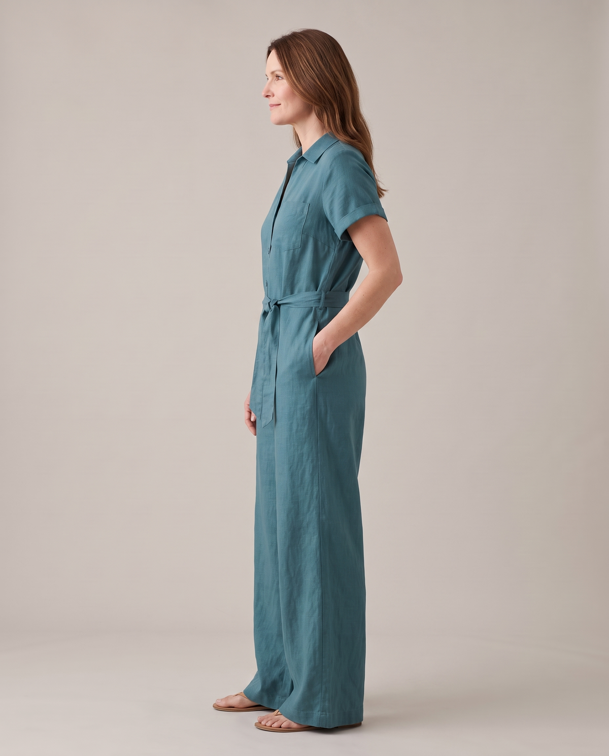 ONE linen wide-leg jumpsuit in Teal, side view of the wide straight leg