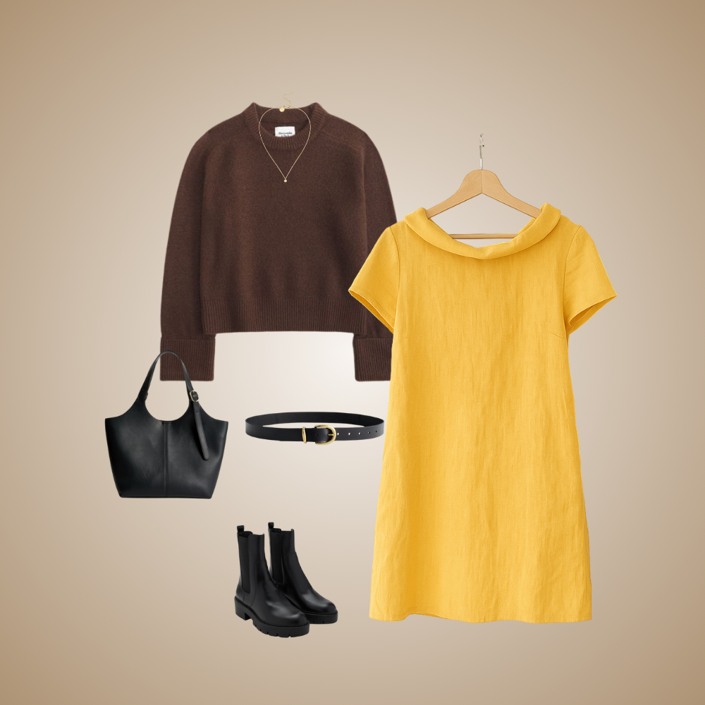 Fall outfit: yellow linen dress with a brown knit sweater, black bag, belt and ankle boots