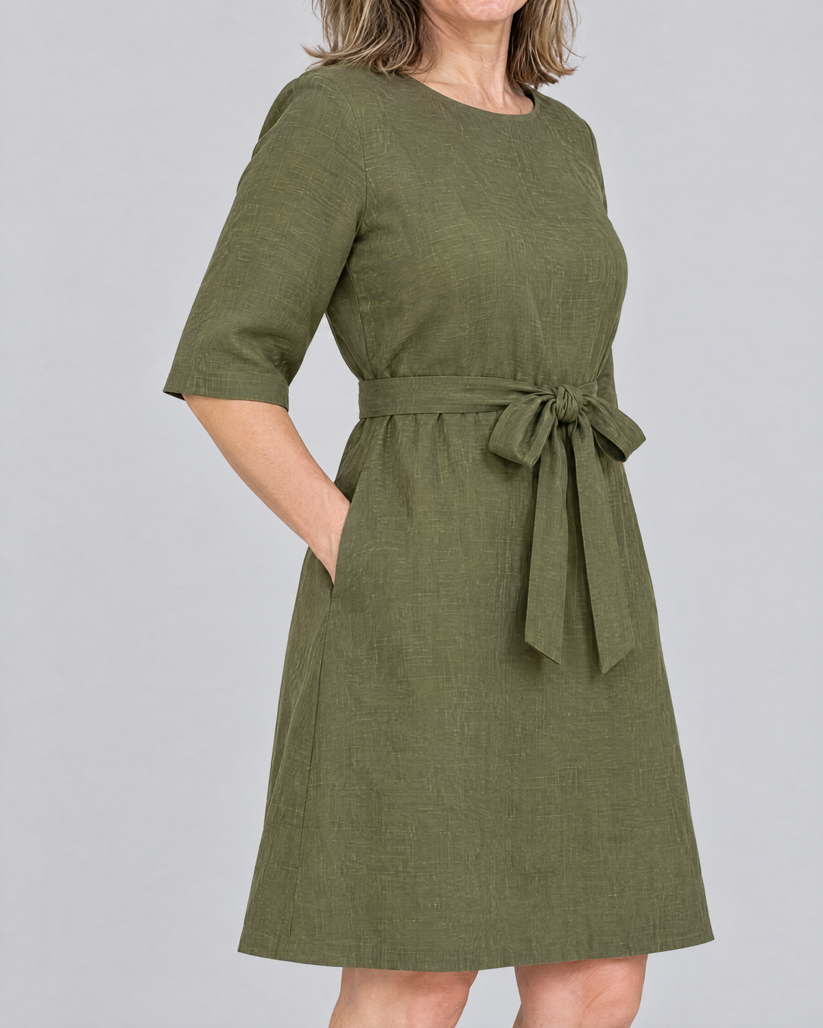 REACH linen dress in Olive Green, close-up of the elbow-length sleeve and stonewashed linen