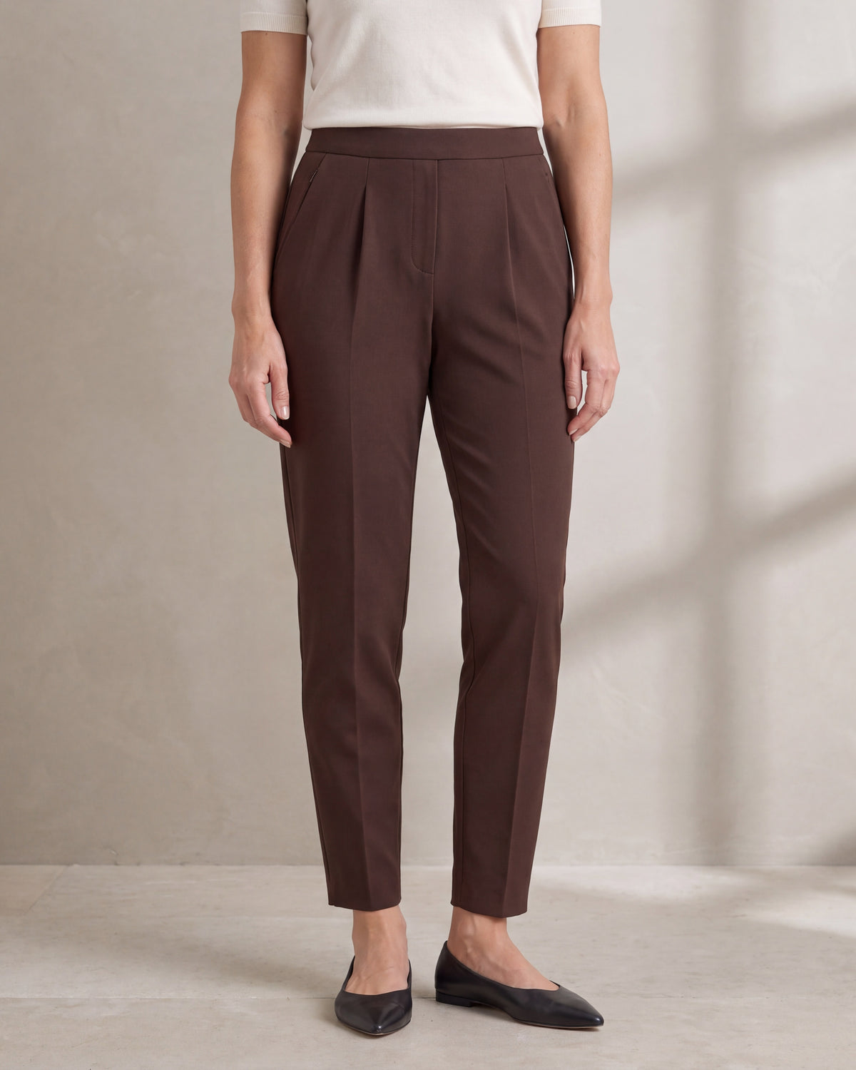 SIT WELL Brown tapered office trousers, close front view