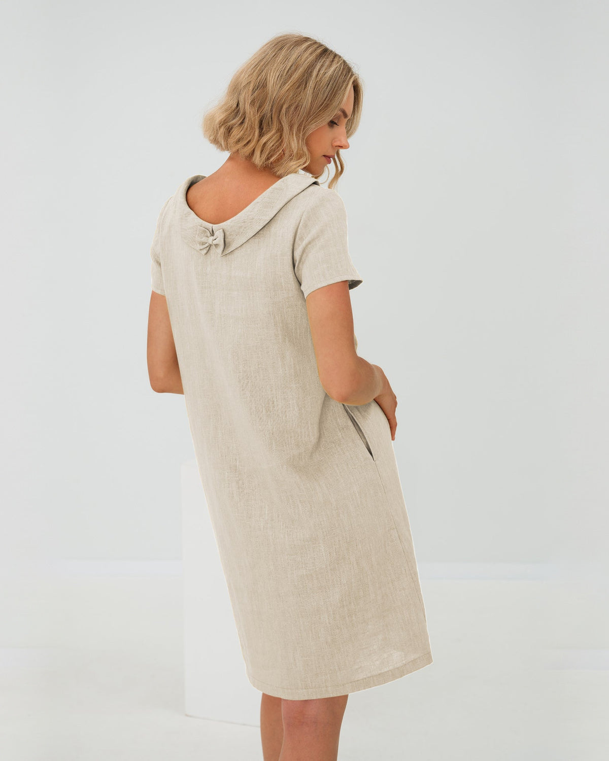 LeMuse STORY linen dress in beige – studio back view #Color_Beige