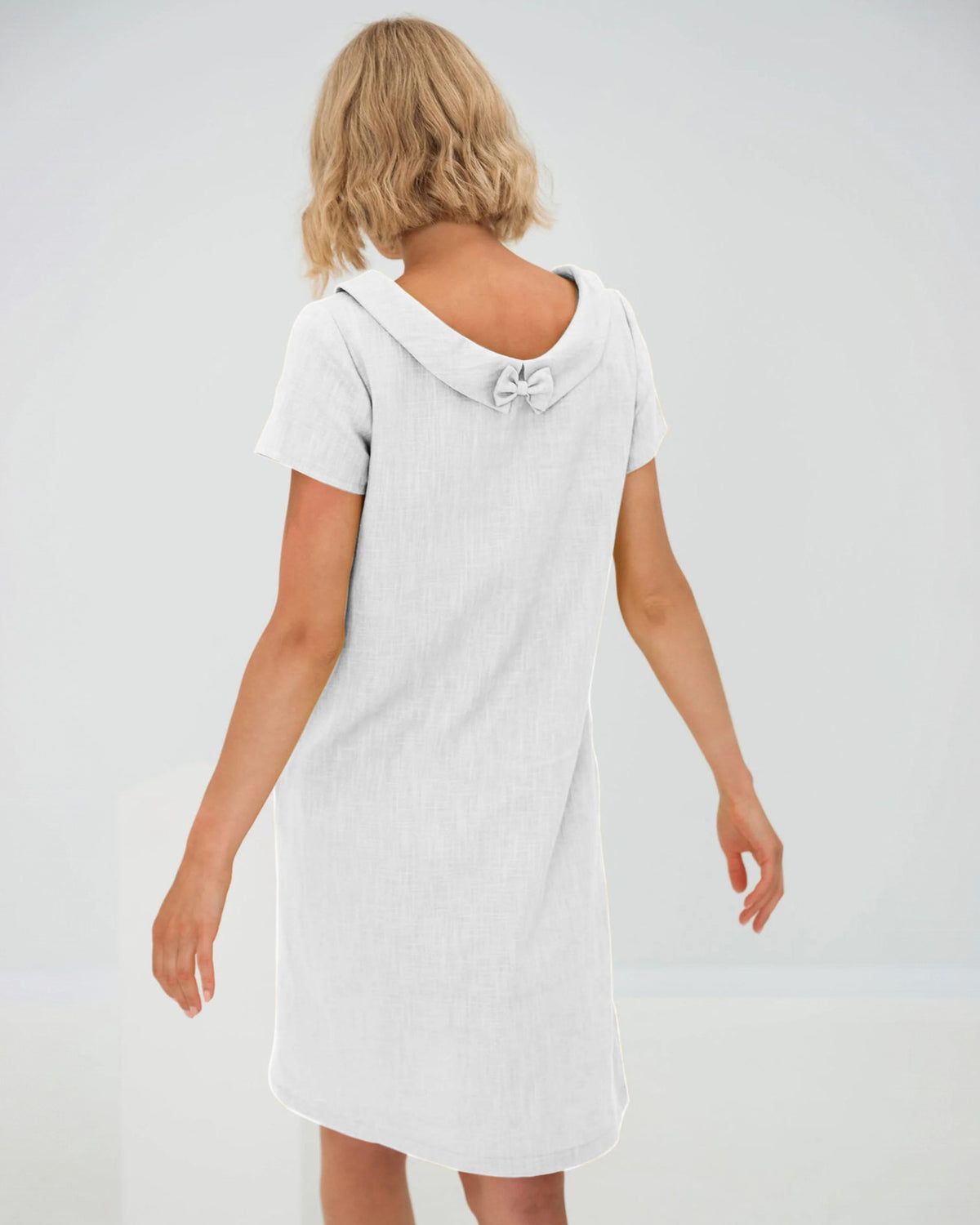 LeMuse STORY linen dress in white – studio side view #Color_White