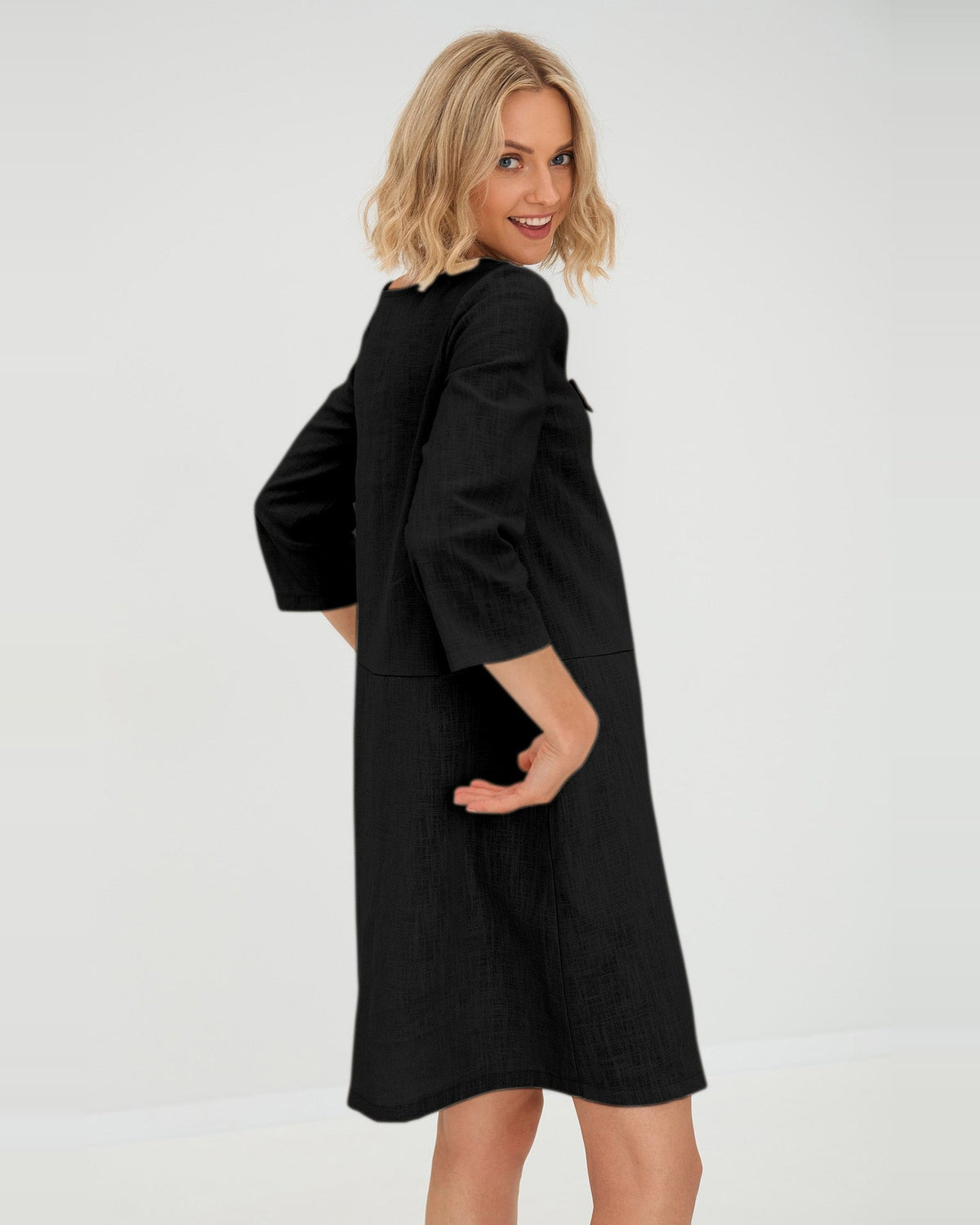 SUN – Linen Blend V-Neck Bow Dress – Black dress, back view over the shoulder, studio #Color_Black