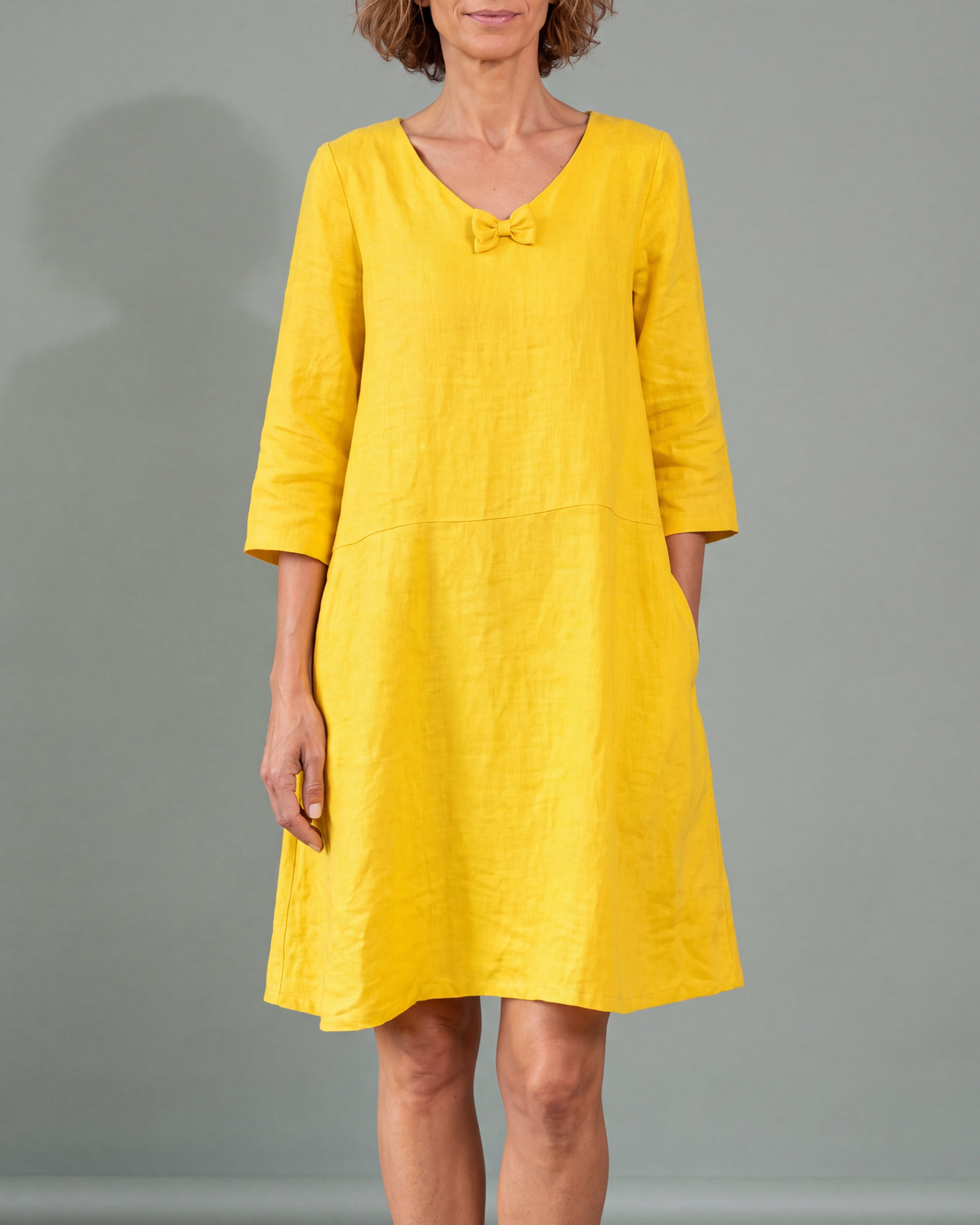 SUN yellow linen blend V-neck bow dress, close front view