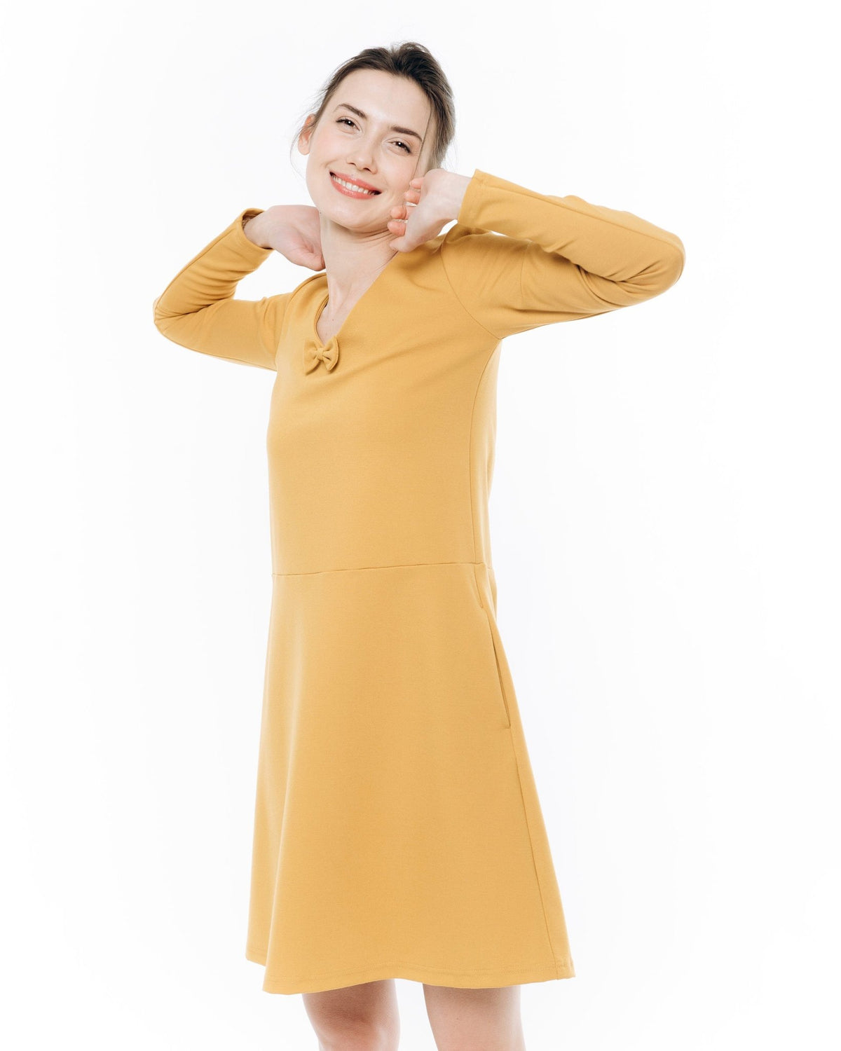 SUN – Italian Punto Milano V-Neck Bow Dress – yellow dress, studio movement shot #Color_Yellow