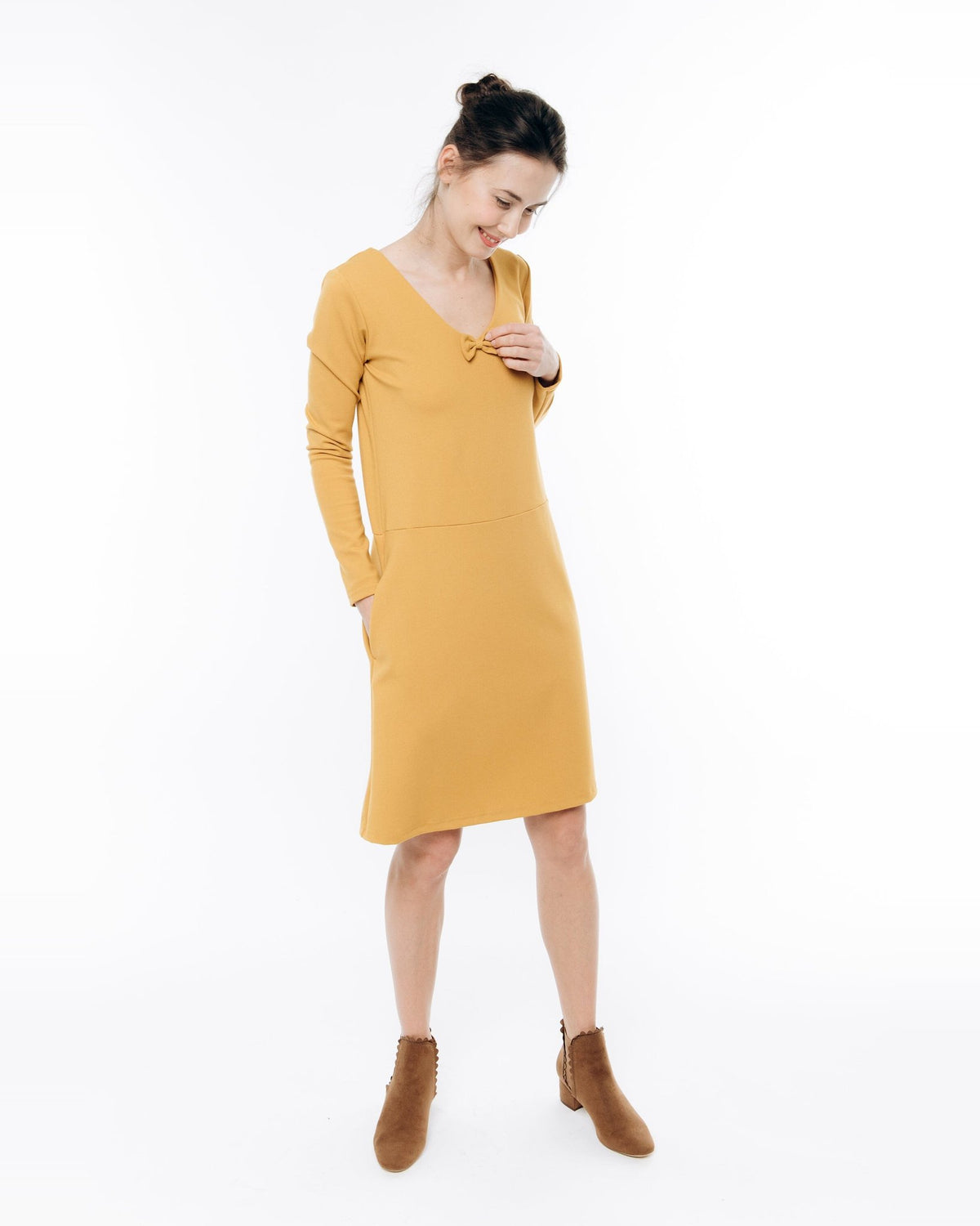 SUN – Italian Punto Milano V-Neck Bow Dress – yellow dress, studio three-quarter side view #Color_Yellow