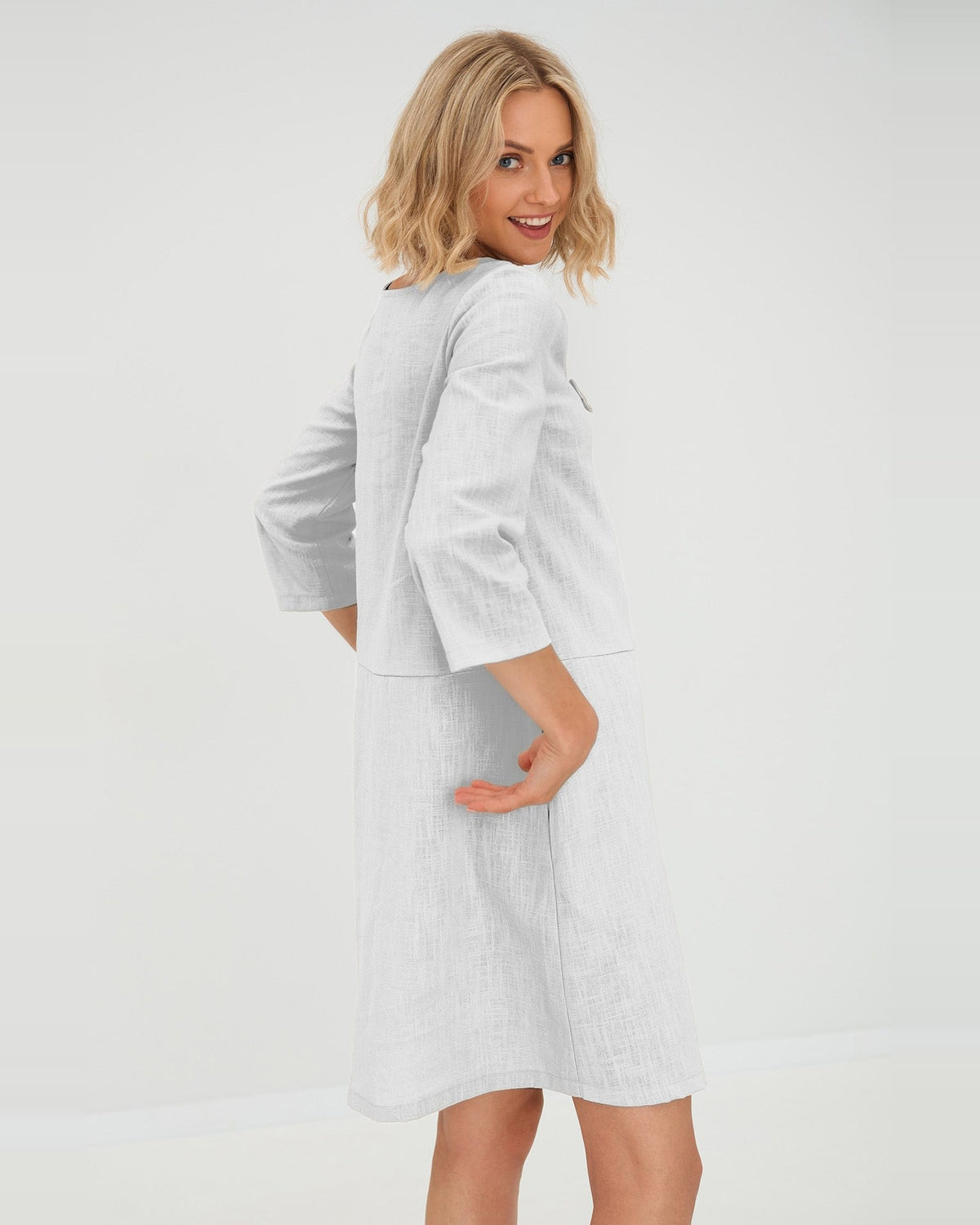 SUN – Linen Blend V-Neck Bow Dress – White dress, back view over the shoulder, studio #Color_White