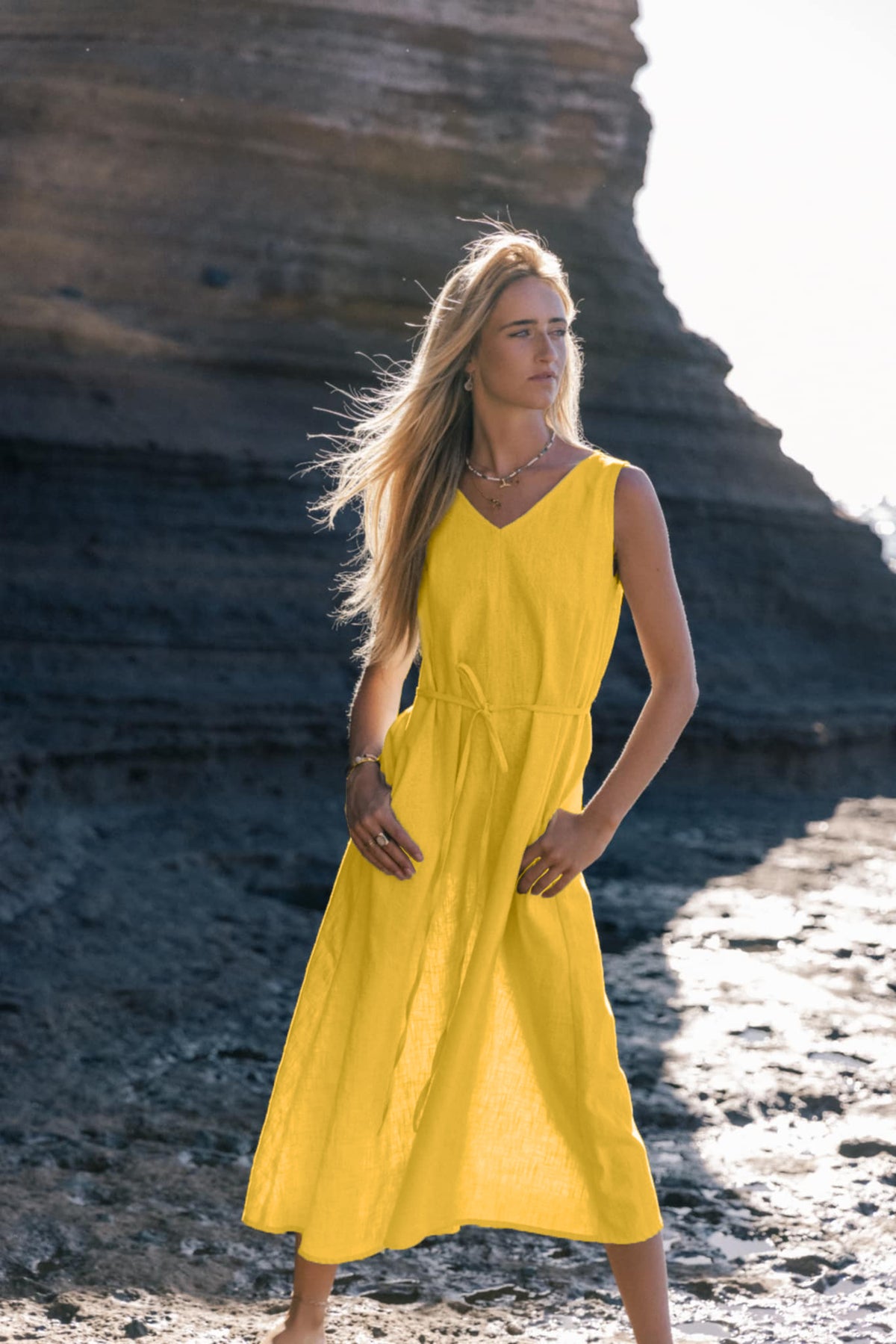 LeMuse SUNSET linen dress in yellow – model front full length by the cliffs #Color_Yellow