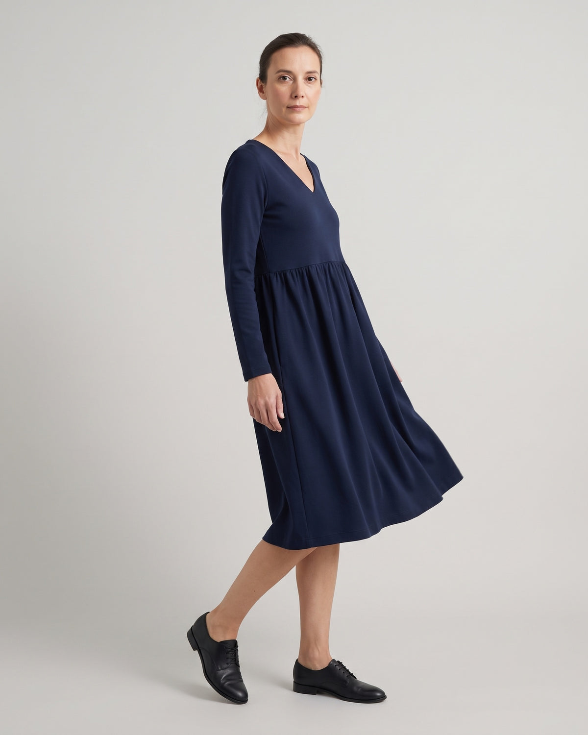 SUNSHINE Punto Milano midi dress in deep blue, side view in motion #Color_Deep blue