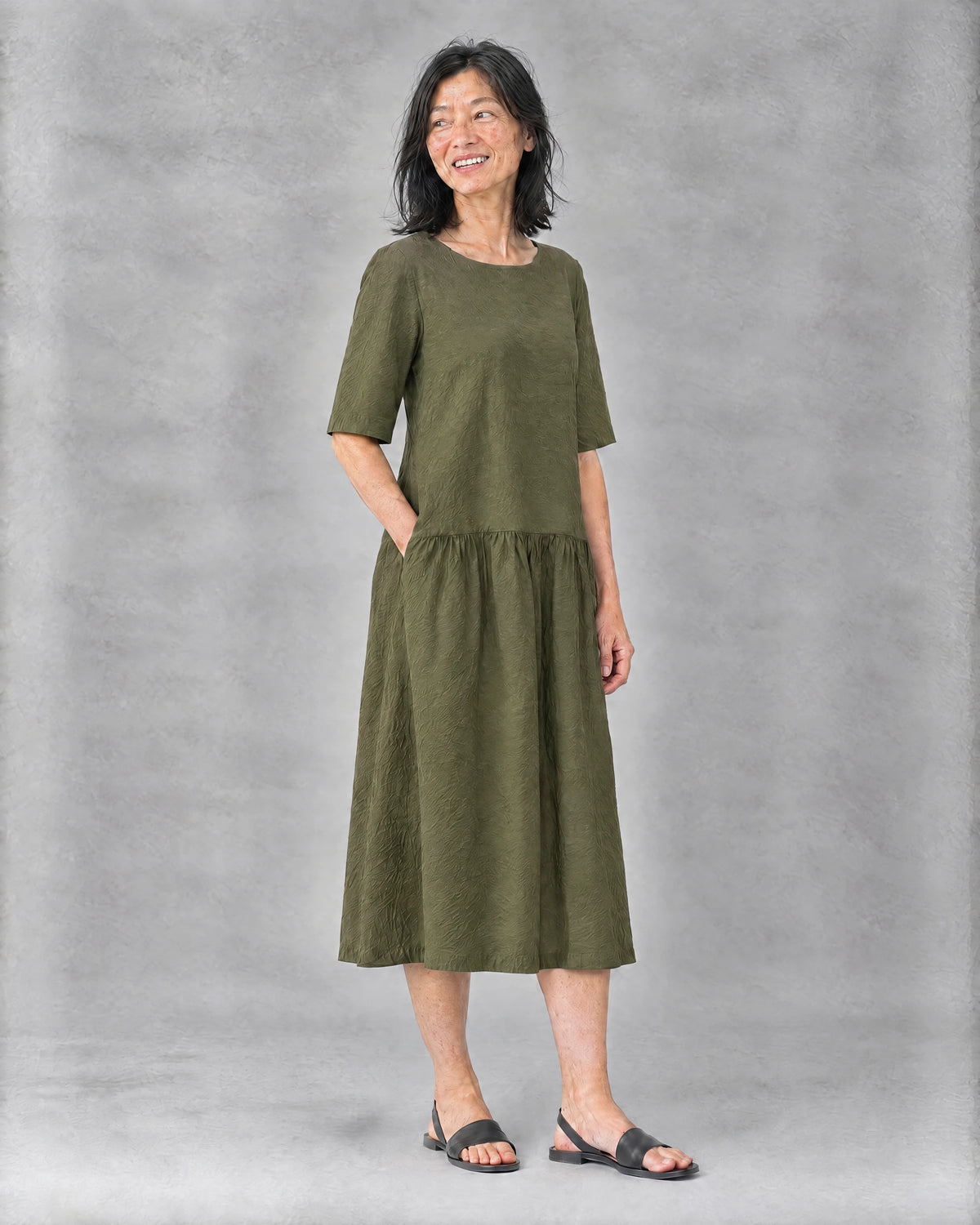 TESSA linen tiered midi dress in olive green, three-quarter front view