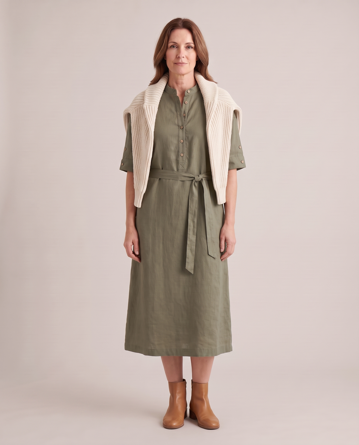 VERA linen midi dress in Olive Green layered with a knit and ankle boots